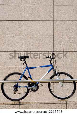 One bike on the parking with marble wall