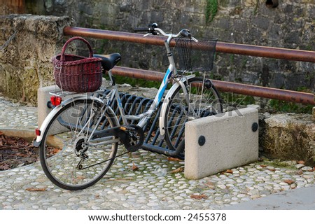 Bike with two basket on the street parking place