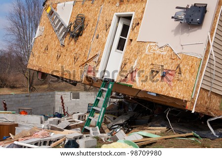 LAPEER COUNTY, MI - MARCH 15: A home heavily damaged by an F2 tornado that swept through Oregon Twp in Lapeer County, MI on March 15, 2012. The photo was taken the next day.