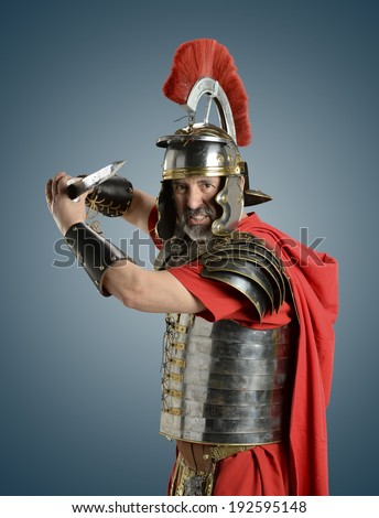 Roman Soldier with sword ready for war isolated on a blue background