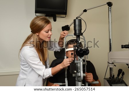Young eye Doctor druring a test with patient in her office