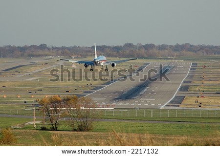 American Airlines plane before landing with airport view