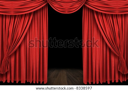 Large red curtain stage opening with dark background