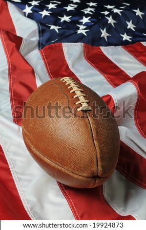 Football against an American flag on a vertical format