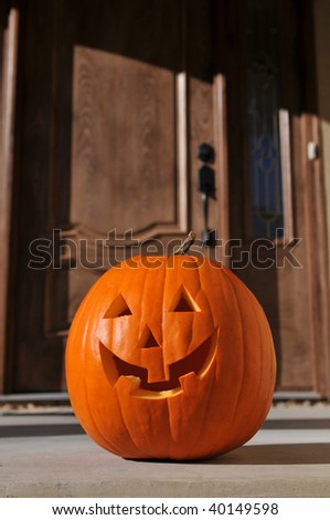 jack o-lantern by the door on a vertical format