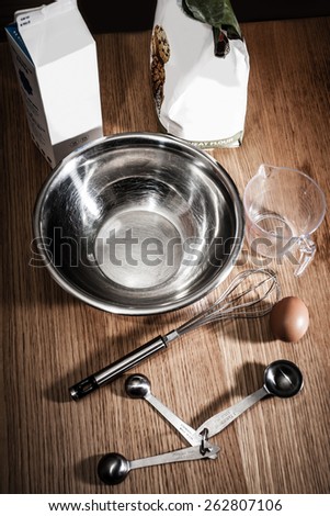 Ingredients and cooking utensils are gathered together, ready make something.