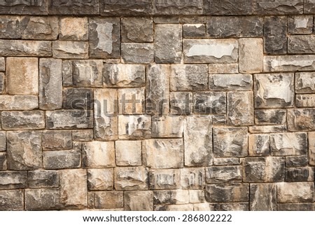 A blank, faux-aged stone wall, perfect for backgrounds and messages.