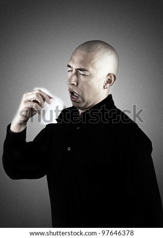 Man is sneezing into a tissue