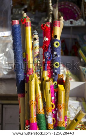 colorful bamboo flutes in Jaipur city bazaar, India