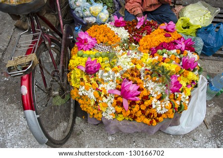 various colorful  flowers religious offerings in Varanasi street market, India