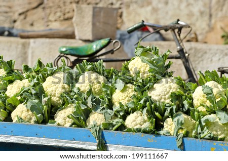fresh cauliflower vegetable in asia street market and bicycle fragment