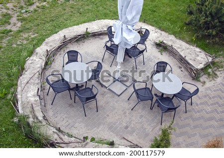 outdoor cafe furniture in summer resort. Table and chairs