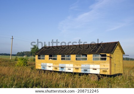 apiary hives  - big bee house truck trailer in  summer field