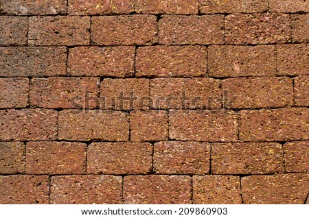 temple big brown brick wall background and texture in Goa, India
