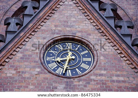 retro clock dial on historical church wall