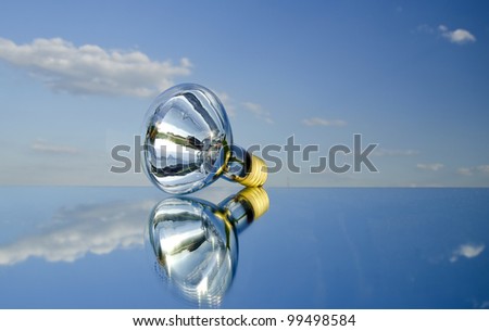 lamp on mirror with reflection and sky