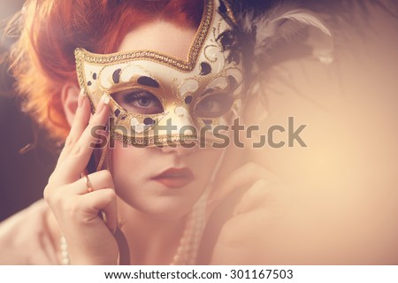 Mysterious image of a beautiful woman with an Italian mask, carnival, warm sunny image processing, portrait,