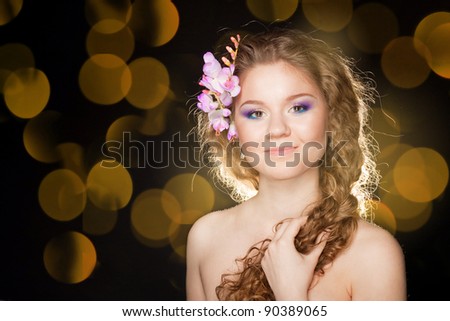 Glamorous portrait of beautiful girl with lush hair.