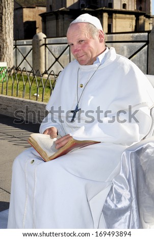 ROMAN FORUM, ROME HISTORICAL CENTER- APRIL 14: A street artist performs in the impersonator of Pope Wojtyla , April 14, 2013 in Rome, Italy.