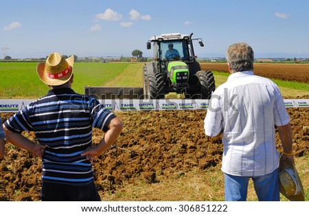 CENTRAL ITALY- JUNE 23:: Agricultural fair with free admission, including displays of tractors and agricultural machinery, crowded with farmers and landowners. June 23, 2013 in Latina, Central Italy.