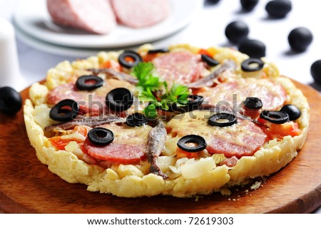 pizza with smoked sausage sprat cheese and black olives