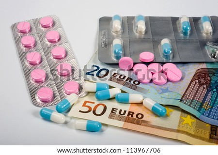 Pills and tablets on paper euro bills