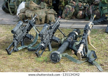 Automatic weapons standing on the ground during a briefing of special forces
