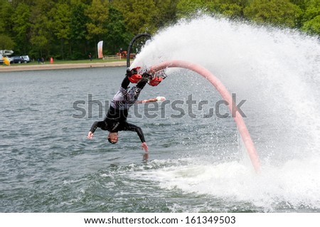 Enschede, Netherlands - May 12: A Man Is Giving A Show How To Keep In Balance, And Shows What You Can Do With The New Sensation Called Flyboarding, May 12, 2013 In The Netherlands.