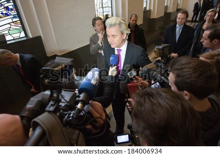 ENSCHEDE, NETHERLANDS - JAN 25: Political leader Geert Wilders of the Dutch center right party PVV surrounded by press giving an interview, January 25, 2013 in the Netherlands