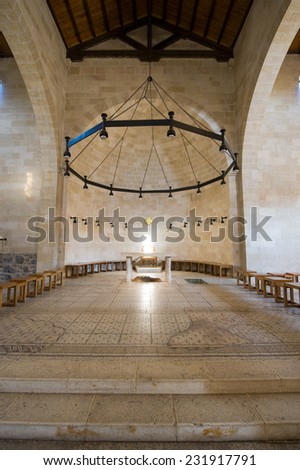 Interior of the Church of the Multiplication of the Loaves and Fish with the rock under the altar where Jesus placed the fish and bread