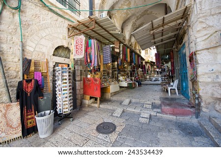 JERUSALEM, ISRAEL - OCT 06, 2014: One of the small narrow streets with shops in the old city of Jerusalem