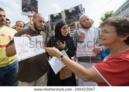 ENSCHEDE, NETHERLANDS - AUG 03, 2014: During a demonstration organized by suryoye christians against the slaughter of christians in the middle east there is a discussion by pro and contra muslims