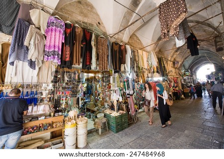 JERUSALEM, ISRAEL - OCTOBER 07, 2014: All kinds of souvenir shops in one of the small streets in the old city of Jerusalem
