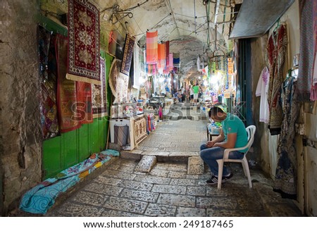 JERUSALEM, ISRAEL - OCTOBER 07, 2014: All kinds of shops in one of the small streets in the old city of Jerusalem