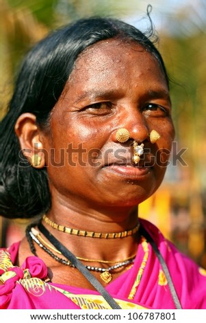 ORISSA, INDIA - JANUARY 30: An Indian tribal lady, dressed in tribal outfit, visits a fair on January 30, 2011 at Orissa, India.