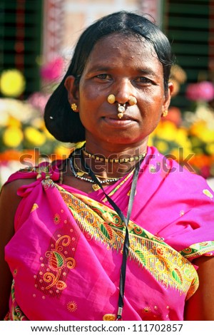 ORISSA, INDIA - JANUARY 30: An unidentified Indian tribal lady wears colorful dress and jewelries and attend annual Tribal fair on January 30, 2011 at Orissa, India.