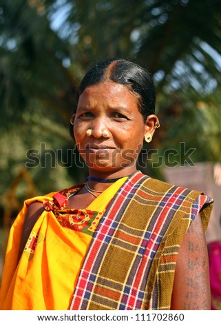 ORISSA, INDIA - JANUARY 30: An unidentified Indian tribal lady wears traditional dress and tattoo and attend annual Tribal fair on January 30, 2011 at Orissa, India.