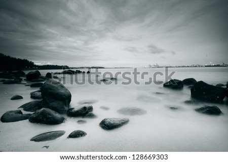 Long exposure landscape of rocks, sea, beach for inspirational quotes
