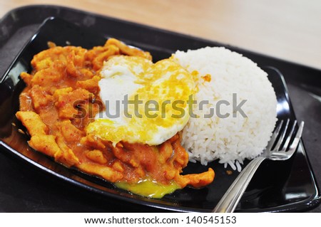 South East Asian Street food with egg and chicken curry rice
