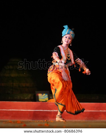 KONARK, INDIA - DECEMBER 04: A professional lead dancer performs classical dance during a national dance festival on December 04, 2011 in Konark, Orissa, India