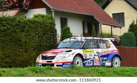 ZLIN,CZECH REP.-SEPTEMBER 2. Driver Kostka and co-driver Houst with car Skoda Fabia S2000 at Barum Rally event,speed check Nr 13.September 2. 2012 in Zlin,Czech republic.