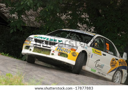 ZLIN,CZECH REP.-AUGUST 23.Driver V.ARAZIM and co-driver J.GAL with car Mitsubishi Lancer at Barum Rally event,speed check Nr.9 August 23.2008 in Zlin,Czech republic.