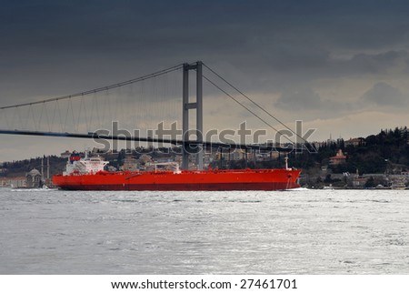 ship under Bosphorus bridge before the storm