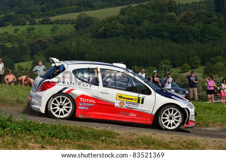 ZLIN,CZECH REP.-AUGUST 27. Driver Bouffier B.and co-driver Panseri X. with car Peugeot 207 S2000 at Barum Rally event,speed check Nr 6,August 27.2011 in Zlin,Czech republic