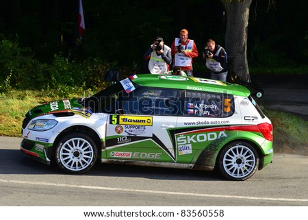ZLIN,CZECH REP.-AUGUST 28. Driver and winner Kopecky J..and co-driver Stary P with car Skoda Fabia S2000 at Barum Rally event,speed check Nr 13.August 28.2011 in Zlin,Czech republic.