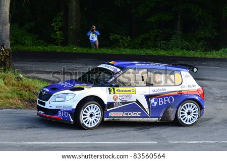 ZLIN,CZECH REP.-AUGUST 28. Driver Loix F..and co-driver Miclotte Fwith car Skoda Fabia S2000 at Barum Rally event,speed check Nr 13.August 28.2011 in Zlin,Czech republic
