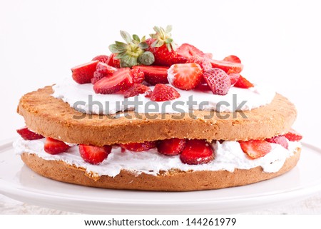 strawberry cream cake on a white background