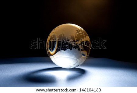 Glass globe in effect light.