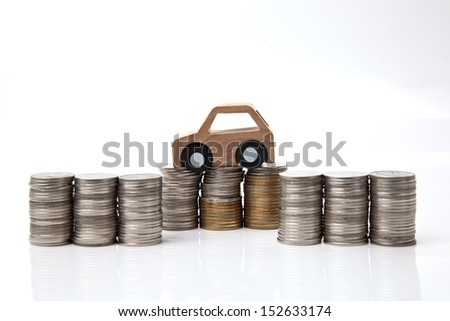 Wooden car model on the coins