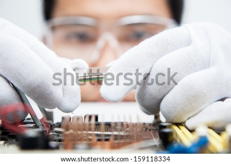 Expert Engineers Examining Computer Equipment.